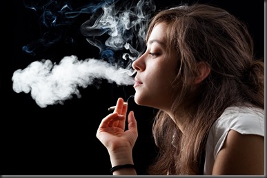 Woman Smoking a Cigarette on Black Background