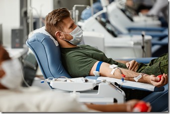 Man Wearing Mask at Blood Donation Side View