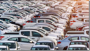 Row of new cars in port.