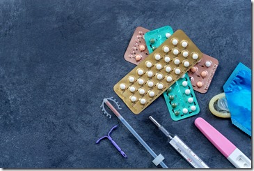 Choosing method of contraception : Birth control pills, an injection syringe, condom, IUD-method, on grey