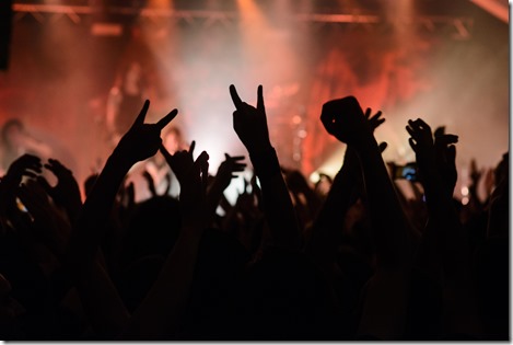 Hand raised showing a heavy metal rock sign