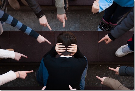 a lonely sad kid being bullied from his mates. A bullying scene in school