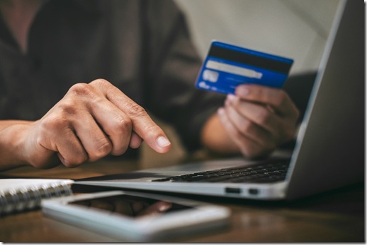 Businessman holding credit card and typing on laptop for online shopping and payment makes a purchase on the Internet, Online payment, Business financial and technology